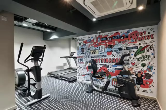 Treadmills elliptical bike vibrant mural gym area at The Frontage in Nottingham Student Accommodation