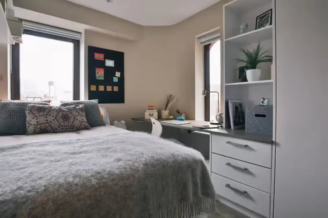 Bed desk and shelves in student room at The Frontage in Nottingham Student Accommodation