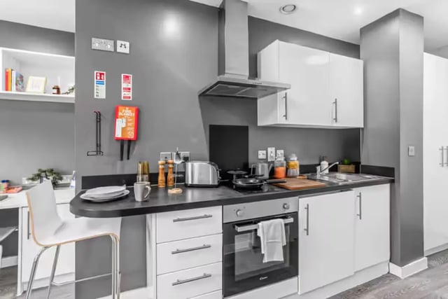Modern kitchen with breakfast bar and appliances kitchen at Northgate House Apartments in Cardiff Student Accommodation