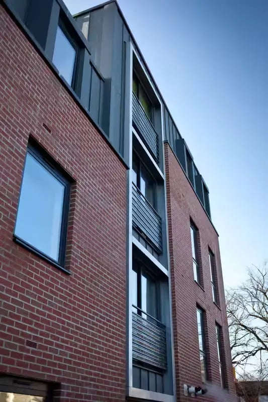 Brick building with windows and balconies exterior at Northgate House Apartments in Cardiff Student Accommodation