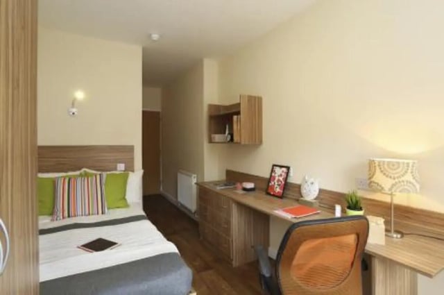Bed desk lamp and chair bedroom at Trinity Hall in Chester Student Accommodation