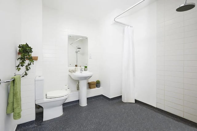 Toilet sink shower with curtain bathroom at Athena Studios in Birmingham Student Accommodation