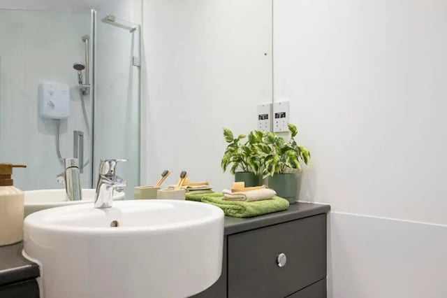 Sink shower plant and cabinet bathroom at Tramworks in Glasgow Student Accommodation