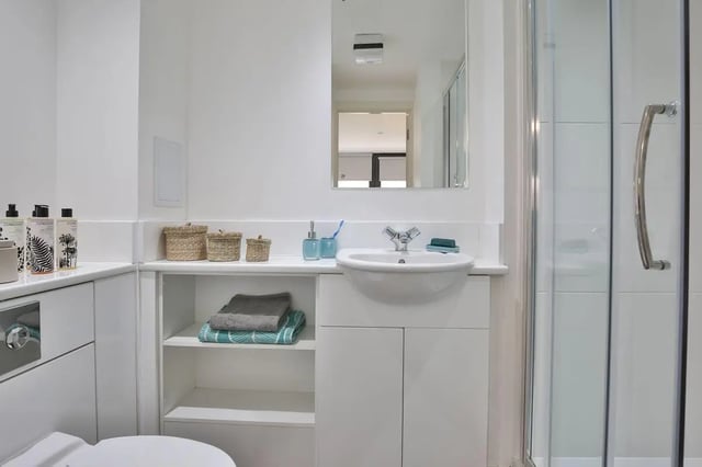 Sink baskets towels mirror shower stall bathroom at The Ballet School in Glasgow Student Accommodation