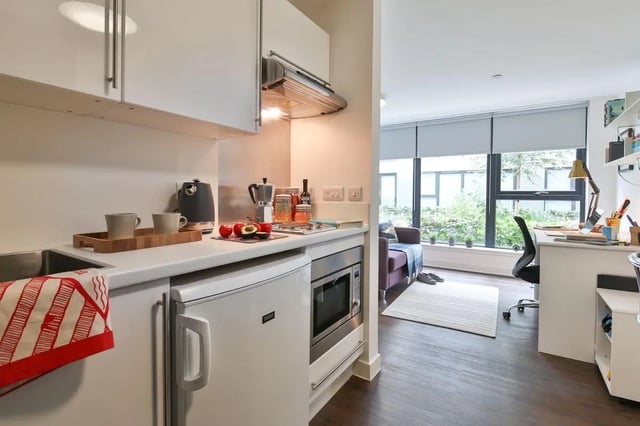 Kitchen area with desk and seating study area at The Ballet School in Glasgow Student Accommodation