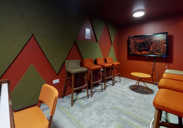 Bar stools TV and piano lounge area at iQ Elgin Place in Glasgow Student Accommodation