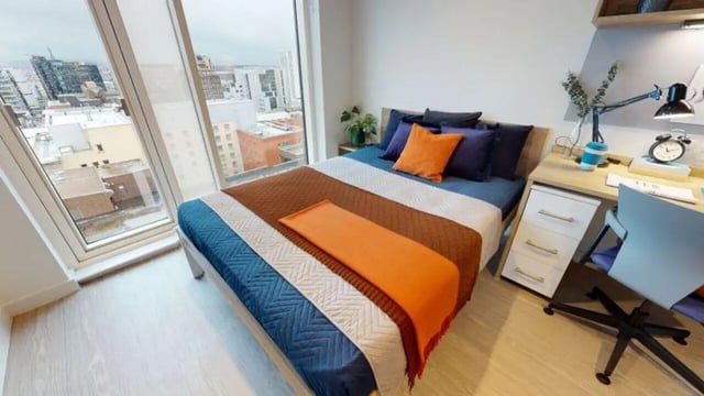 Bed with study desk and city view bedroom at iQ Elgin Place in Glasgow Student Accommodation