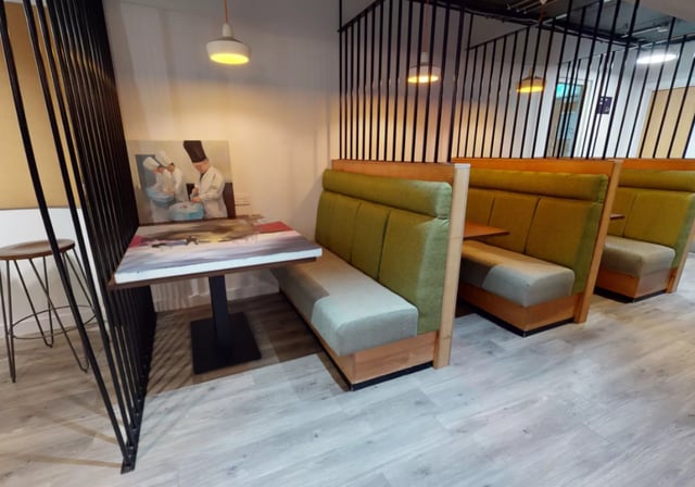 Booth seating painting and stool common area at iQ Elgin Place in Glasgow Student Accommodation