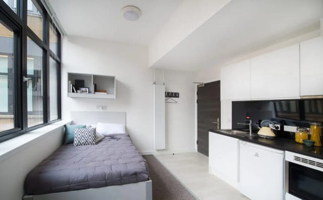 Bed kitchen and sink studio apartment at Clifton & Stewart House in Glasgow Student Accommodation