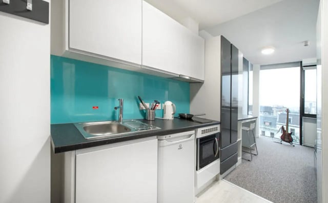 Modern kitchen with sink kettle and guitar kitchen at Clifton & Stewart House in Glasgow Student Accommodation