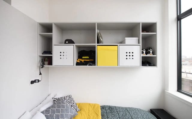 Shelving with storage boxes and clothing bedroom area at Clifton & Stewart House in Glasgow Student Accommodation