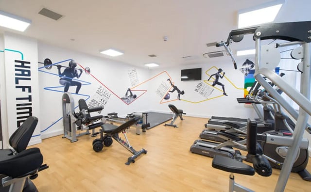 Weight machines treadmills rowers gym area at Clifton & Stewart House in Glasgow Student Accommodation