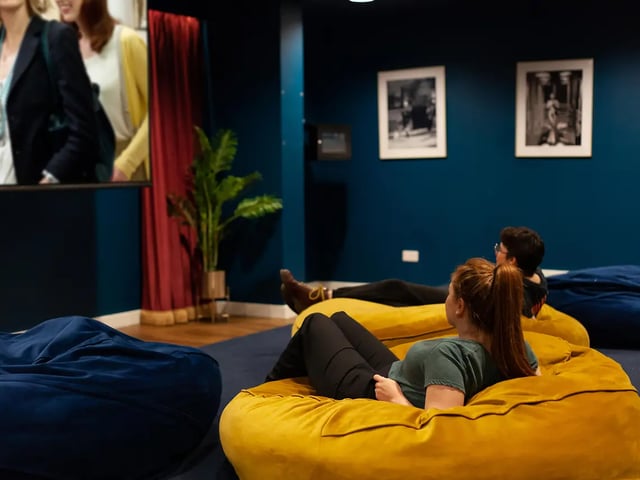 Beanbag chairs people watching movie playing area at Yugo Belaton House in Bournemouth Student Accommodation