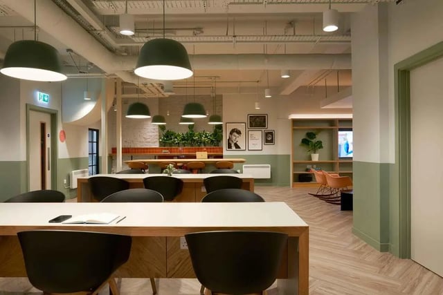 Modern communal study area with tables chairs living room at Culver House in Bristol Student Accommodation