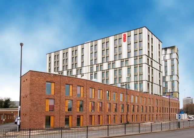 Modern brick and white building exterior exterior at AXO Paradise Student Village in Coventry Student Accommodation