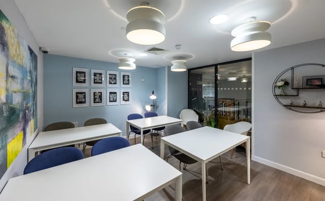 Tables and chairs with motivational posters Communal area at Haddington Place in Edinburgh Student Accommodation