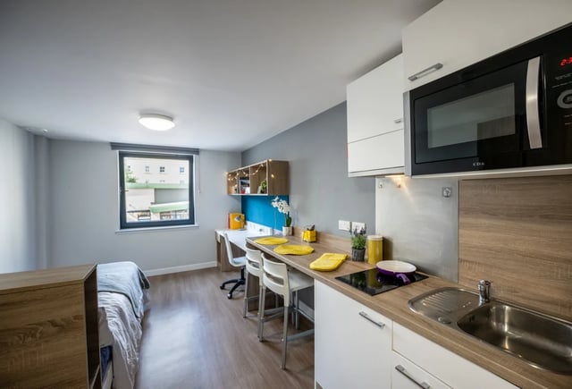 Bed desk microwave and kitchen area at Haddington Place in Edinburgh Student Accommodation