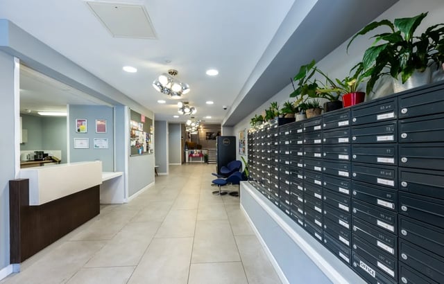 Mailboxes reception desk and plants hallway interior at Haddington Place in Edinburgh Student Accommodation