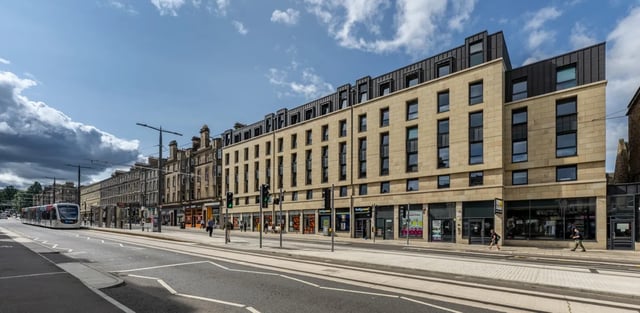 Modern building with many windows and shops exterior at Haddington Place in Edinburgh Student Accommodation