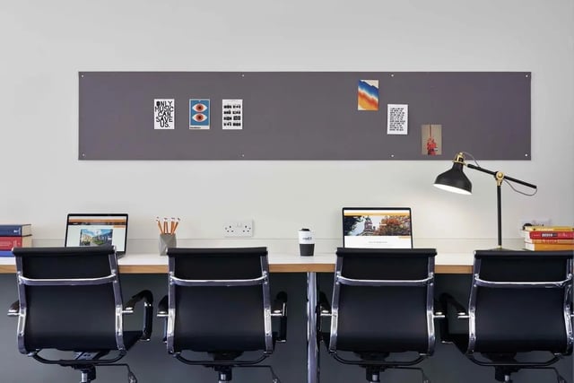Four black chairs laptops books lamp study area at Asa Briggs House in Leeds Student Accommodation