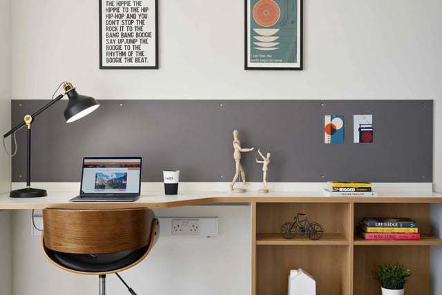 Laptop cup lamp wooden chair desk study area at Asa Briggs House in Leeds Student Accommodation