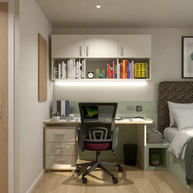 Desk chair books shelves with laptop study area at Broadcasting Tower in Leeds Student Accommodation