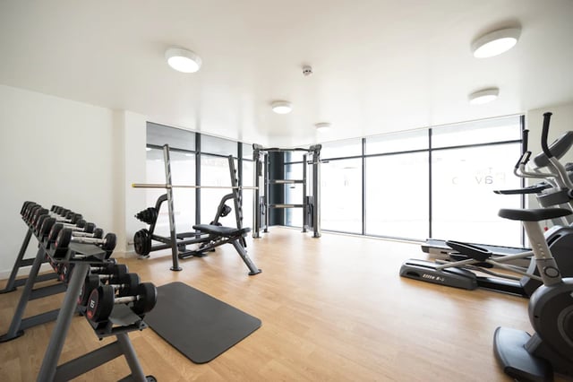 Dumbbells weight bench and cardio machines gym at The Pavilion - Leeds in Leeds Student Accommodation