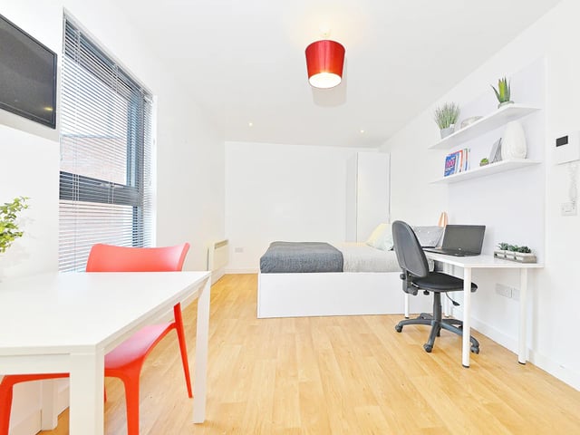 Bed desk and chair with laptop bedroom study area at The Pavilion - Leeds in Leeds Student Accommodation