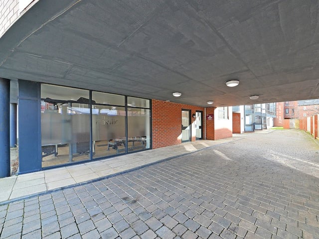 Brick building entrance with pavement and canopy exterior at The Pavilion - Leeds in Leeds Student Accommodation