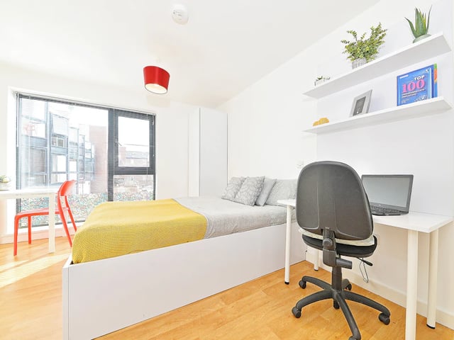 Bed desk chair and shelves bedroom at The Pavilion - Leeds in Leeds Student Accommodation