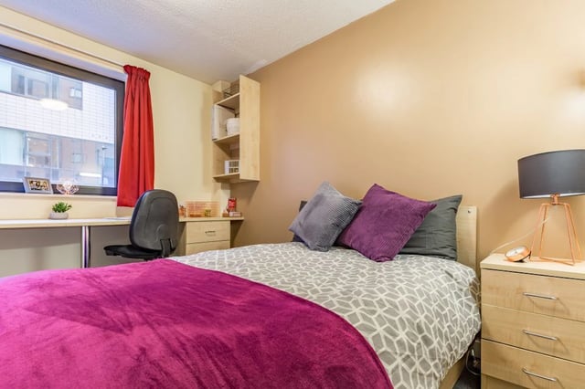 Bed desk chair pillows and lamp bedroom at The Pinnacles in Sheffield Student Accommodation