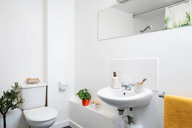 White toilet sink soap dispenser toothbrush holder bathroom at Somerset Court in London Student Accommodation