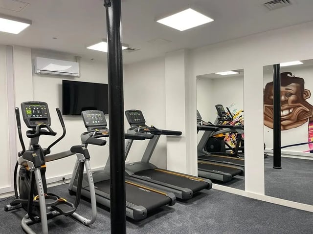 Elliptical machine treadmills air conditioner and TV gym area at Silk Mill Lancaster in Lancaster Student Accommodation
