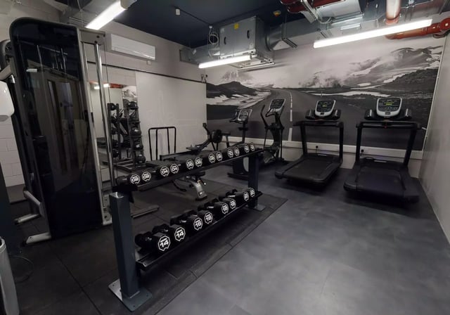Treadmills elliptical rowers and dumbbells gym area at iQ Bankside in London Student Accommodation