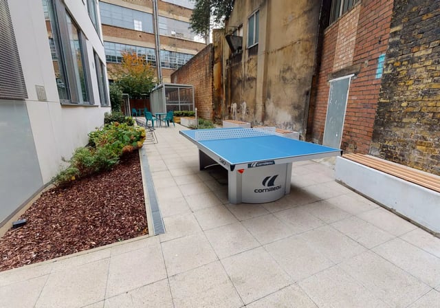Blue ping pong table with seating area exterior at iQ Bankside in London Student Accommodation