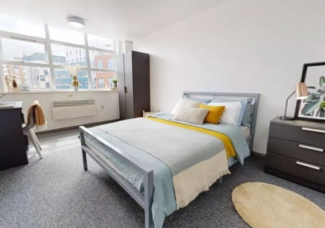 Bed desk wardrobe and radiator bedroom at iQ Stephenson House in Newcastle Upon Tyne Student Accommodation