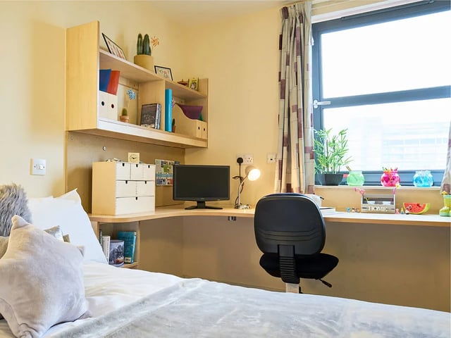 Desk bed shelf computer and window bedroom at Europa in Liverpool Student Accommodation