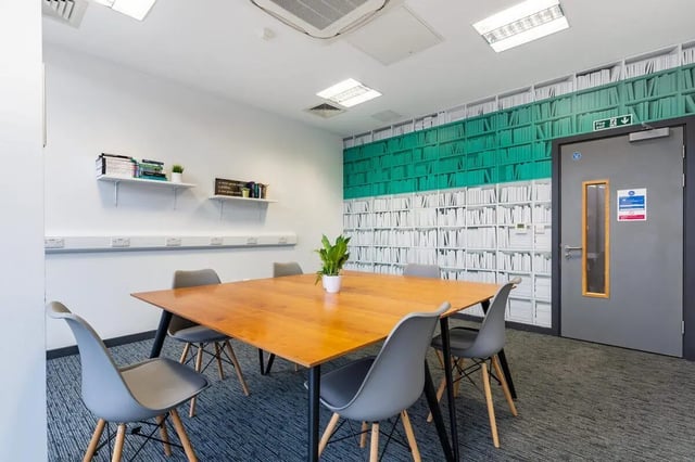 Table with chairs on patterned carpet study area at Glassworks - Liverpool in Liverpool Student Accommodation