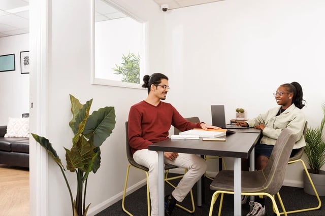 Students sitting at a table with laptops study area at Leadmill Point in Sheffield Student Accommodation