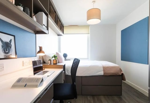Desk bed chair laptop and shelves bedroom at Aparto Arbury Court in Kingston Upon Thames Student Accommodation