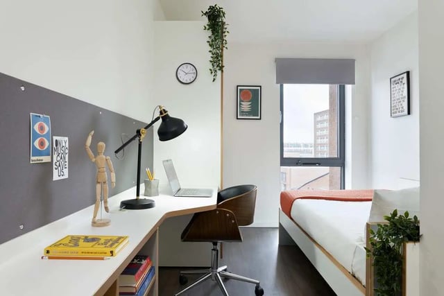 Desk lamp laptop mannequin wooden chair bed bedroom at Sharman Court in Sheffield Student Accommodation