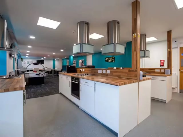 Two kitchen island units with ovens and stoves Kitchen at St Leonard's House in Lancaster Student Accommodation