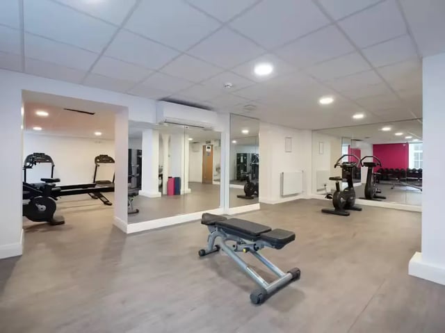 Rowing machine exercise bikes weight bench gym at St Leonard's House in Lancaster Student Accommodation