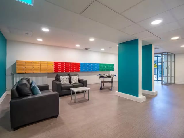 Sofas mailboxes foosball table communal area at St Leonard's House in Lancaster Student Accommodation