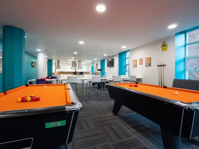 Two orange pool tables with balls shared space at St Leonard's House in Lancaster Student Accommodation