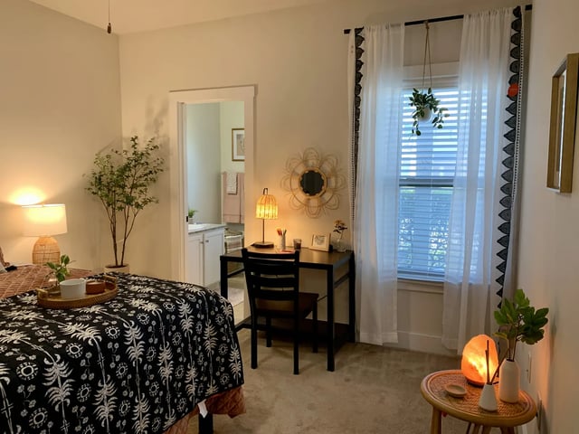 Bed with tray desk and chair bedroom at The Retreat West in Orlando Student Accommodation