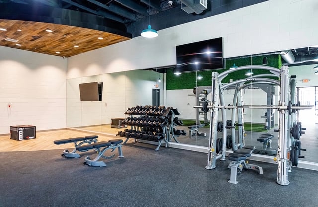 Dumbbell rack weight bench and smith machine gym at Vale East in Orlando Student Accommodation