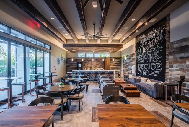 Chalkboard art sofa tables chairs bar lounge living room at Vale East in Orlando Student Accommodation