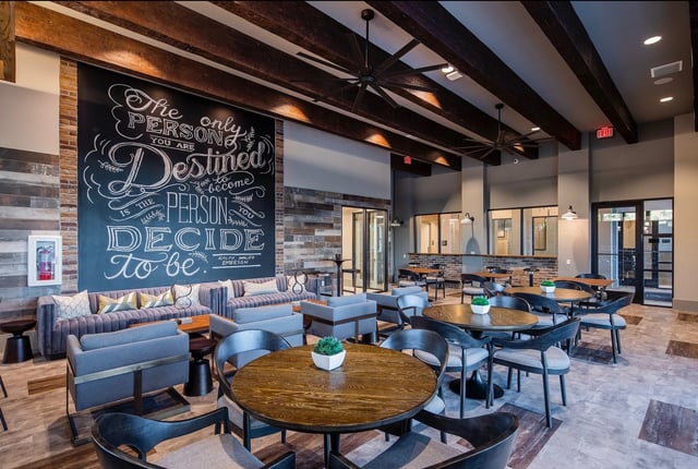 Chalkboard wall seating tables and chairs common area at Vale East in Orlando Student Accommodation