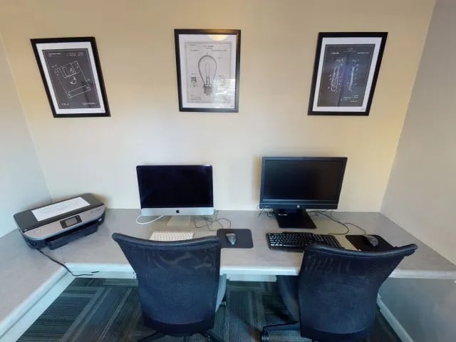 Computers printer and chairs study area at Seminole Flatts in Tallahassee Student Accommodation